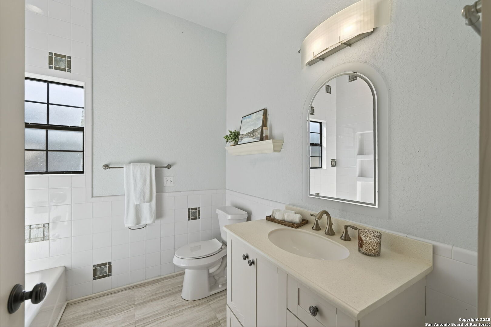 905 Cypress Pass Road Spring Branch, TX 78070 - Photo 26 of 42 a bathroom with a toilet sink and mirror