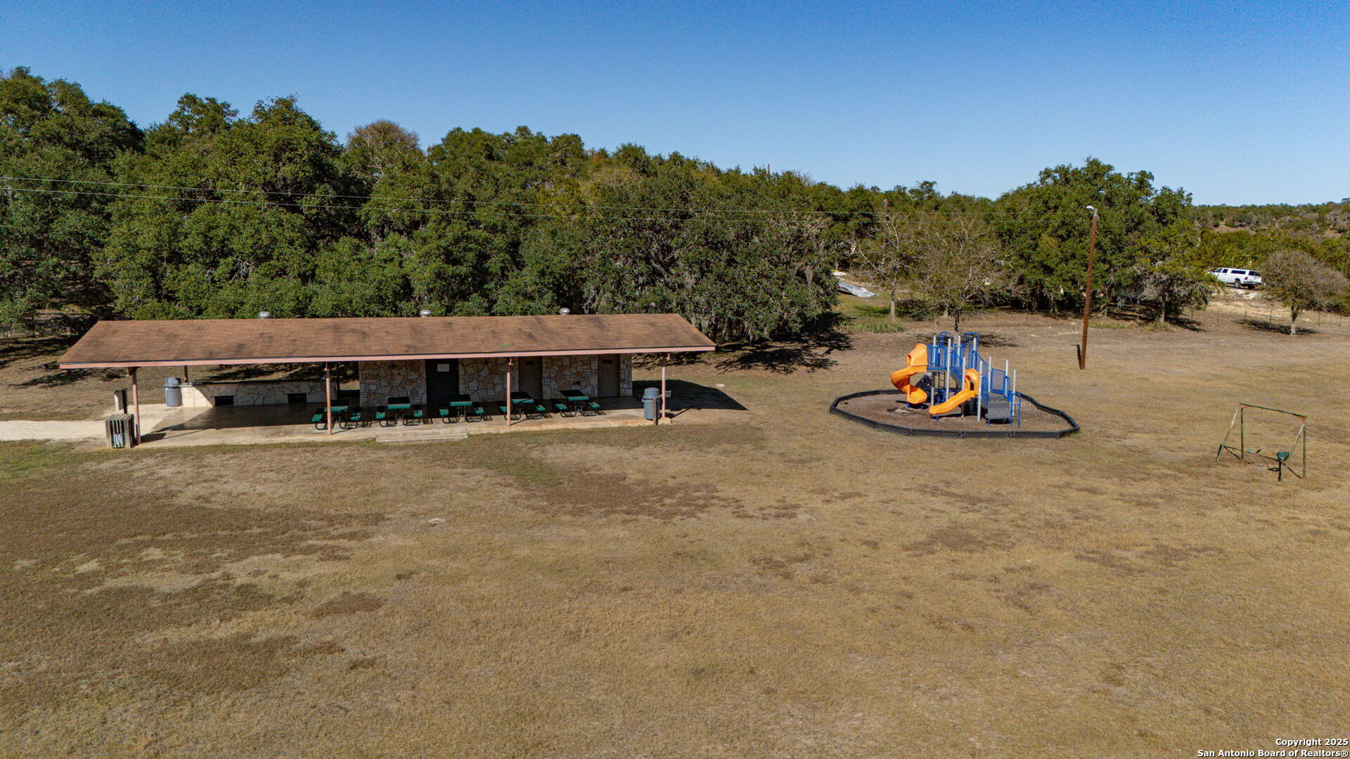 905 Cypress Pass Road Spring Branch, TX 78070 - Photo 42 of 42 a view of a swimming pool with a yard