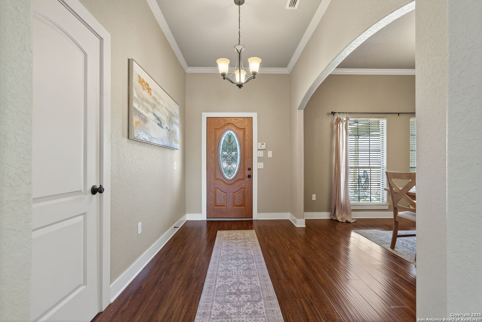 905 Cypress Pass Road Spring Branch, TX 78070 - Photo 5 of 42 a view of a hallway with wooden floor and staircase