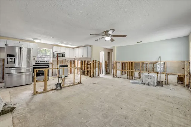 a view of a kitchen with appliances and cabinets