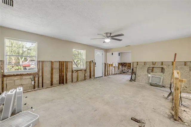 a view of a livingroom with furniture and window