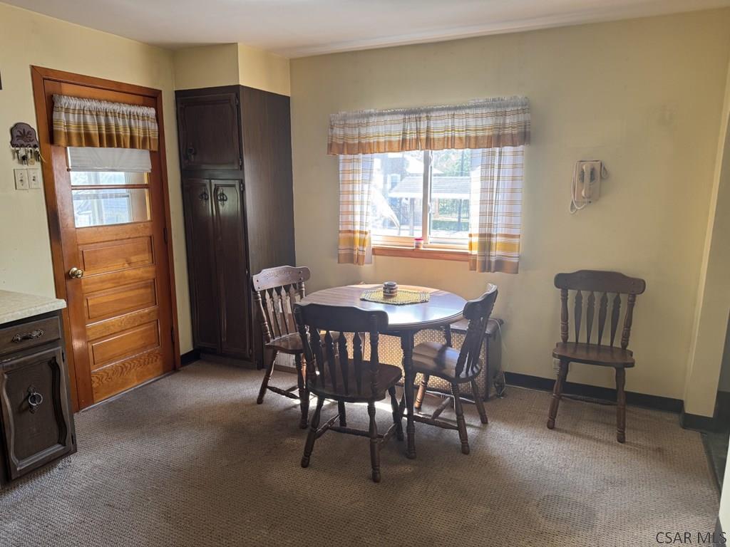 139 Reed Street Elmora, PA 15737 - Photo 9 of 23 a dining room with furniture window and wooden floor