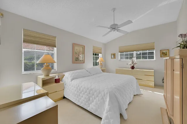 a bedroom with a bed bathroom and window