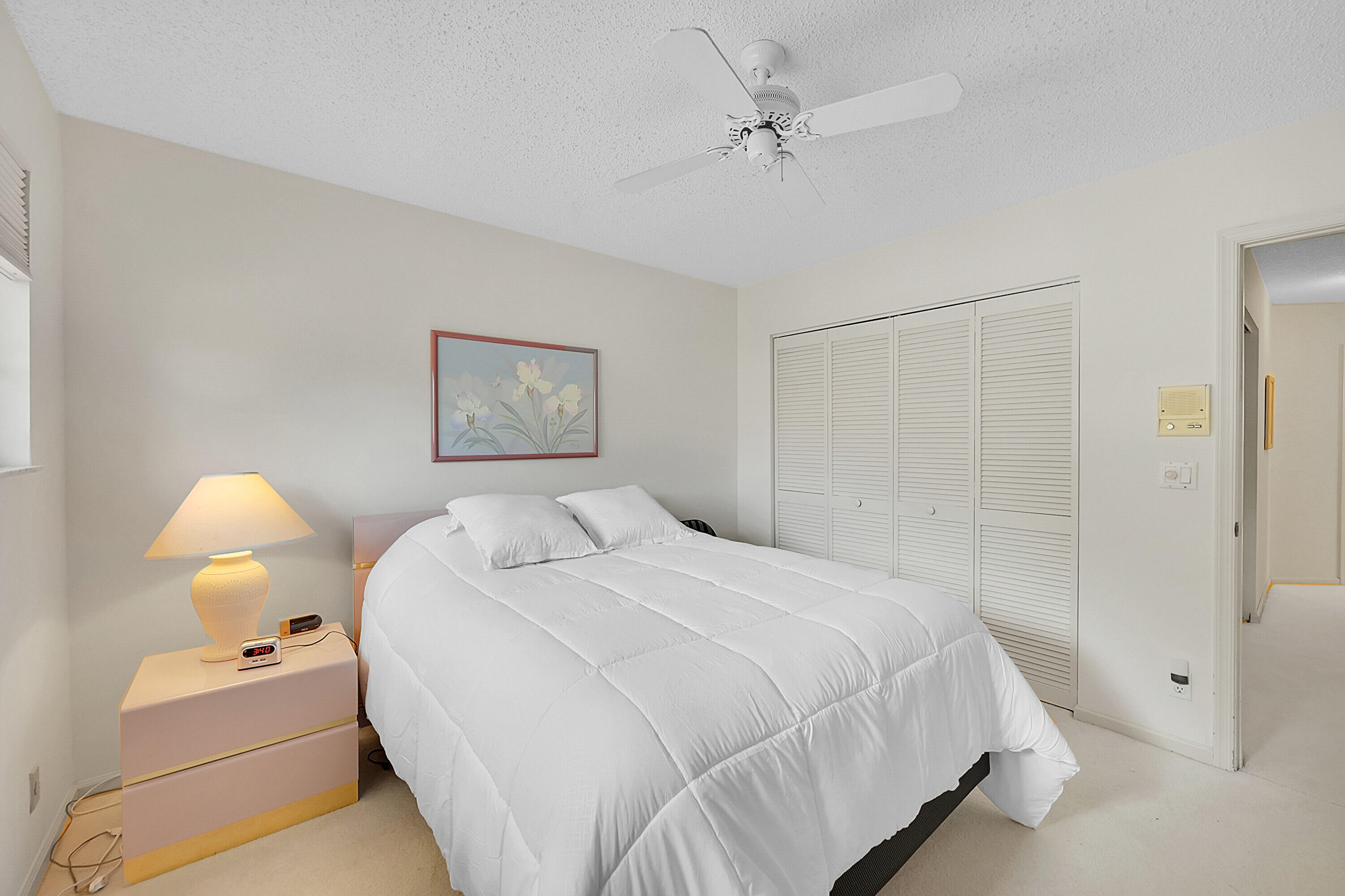 17270 Boca Club Boulevard, Unit 1702 Boca Raton, FL 33487 - Photo 26 of 41 a bedroom with a bed and a lamp