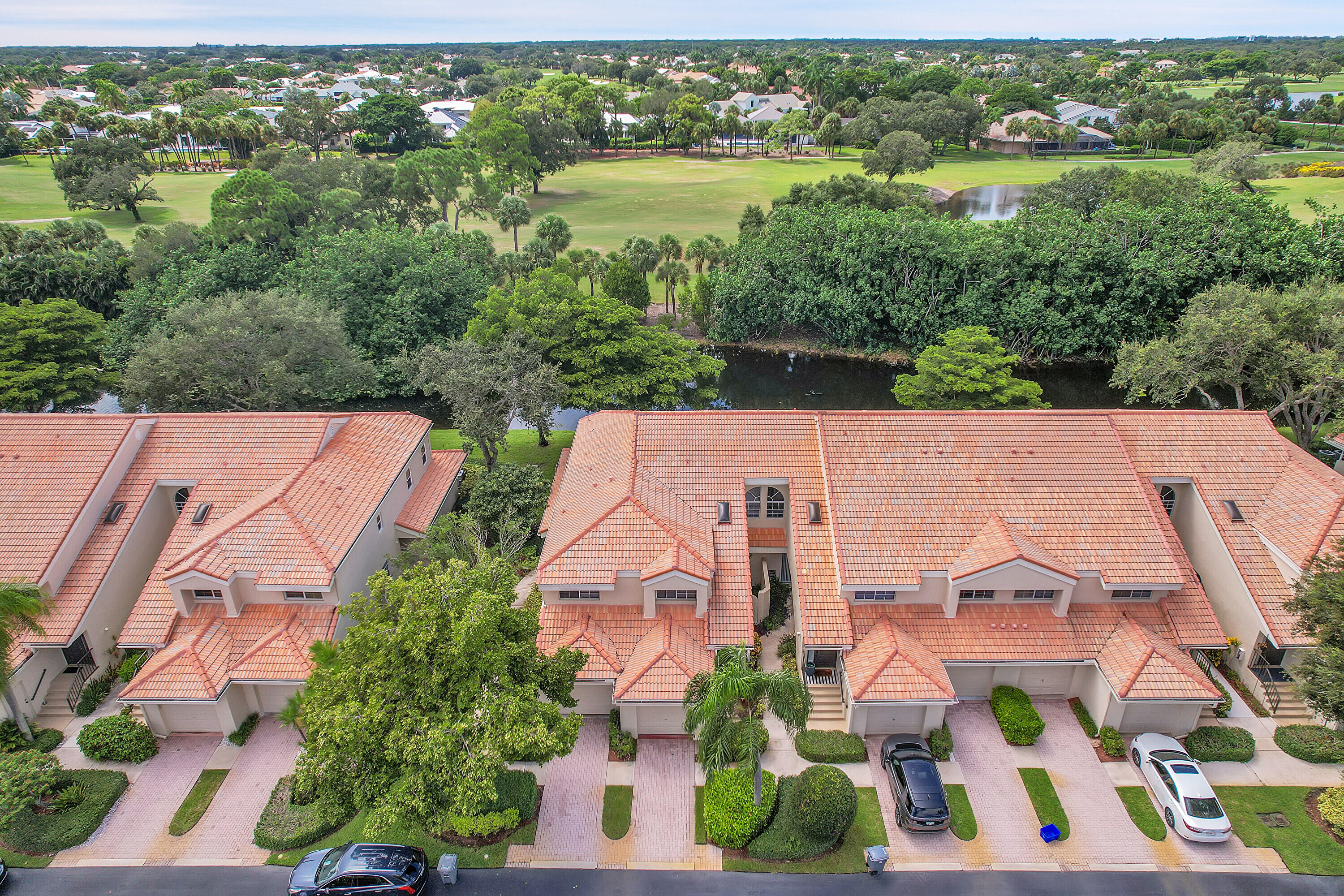 17270 Boca Club Boulevard, Unit 1702 Boca Raton, FL 33487 - Photo 32 of 41 an aerial view of multiple houses with yard