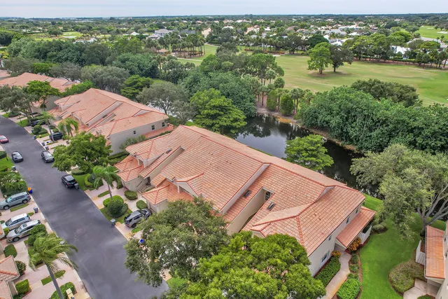 an aerial view of house with yard