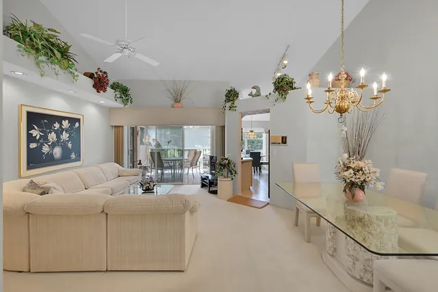 a living room with furniture chandelier and a chandelier