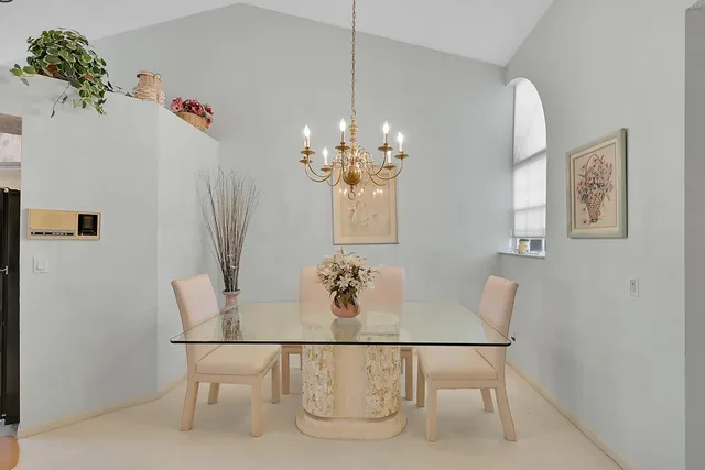 a dining room with furniture and window