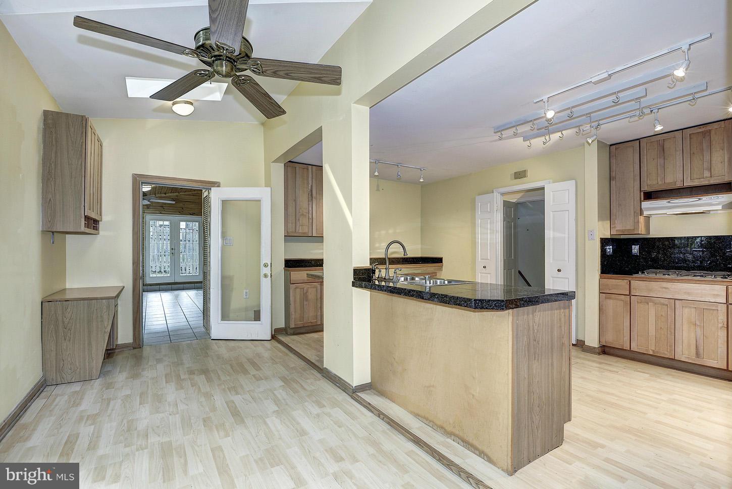 10516 Gainsborough Road Potomac, MD 20854 - Photo 12 of 30 KITCHEN TO SUNROOM