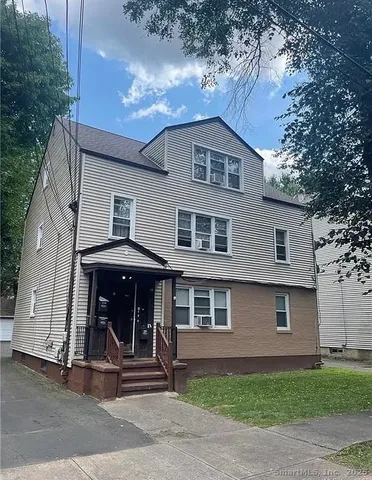 a front view of a house with a garage