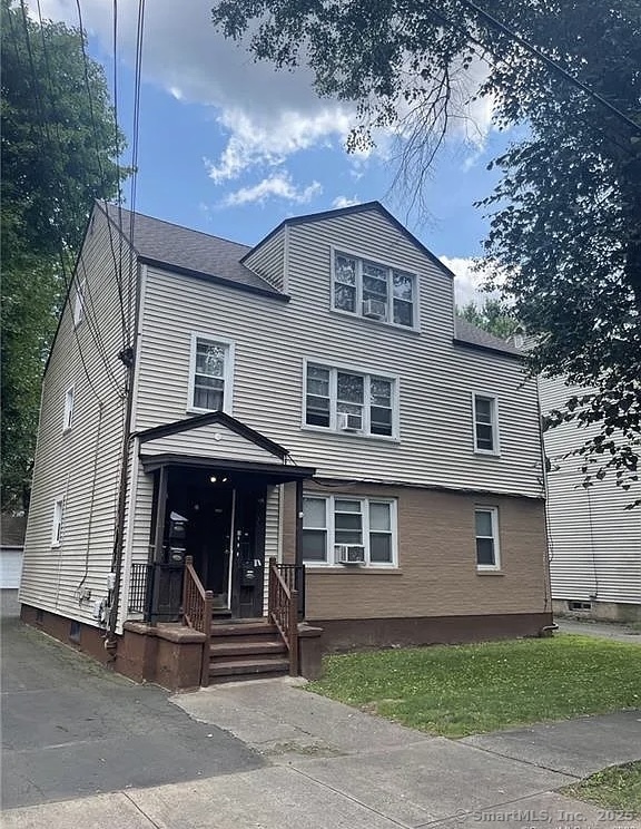 a front view of a house with a garage
