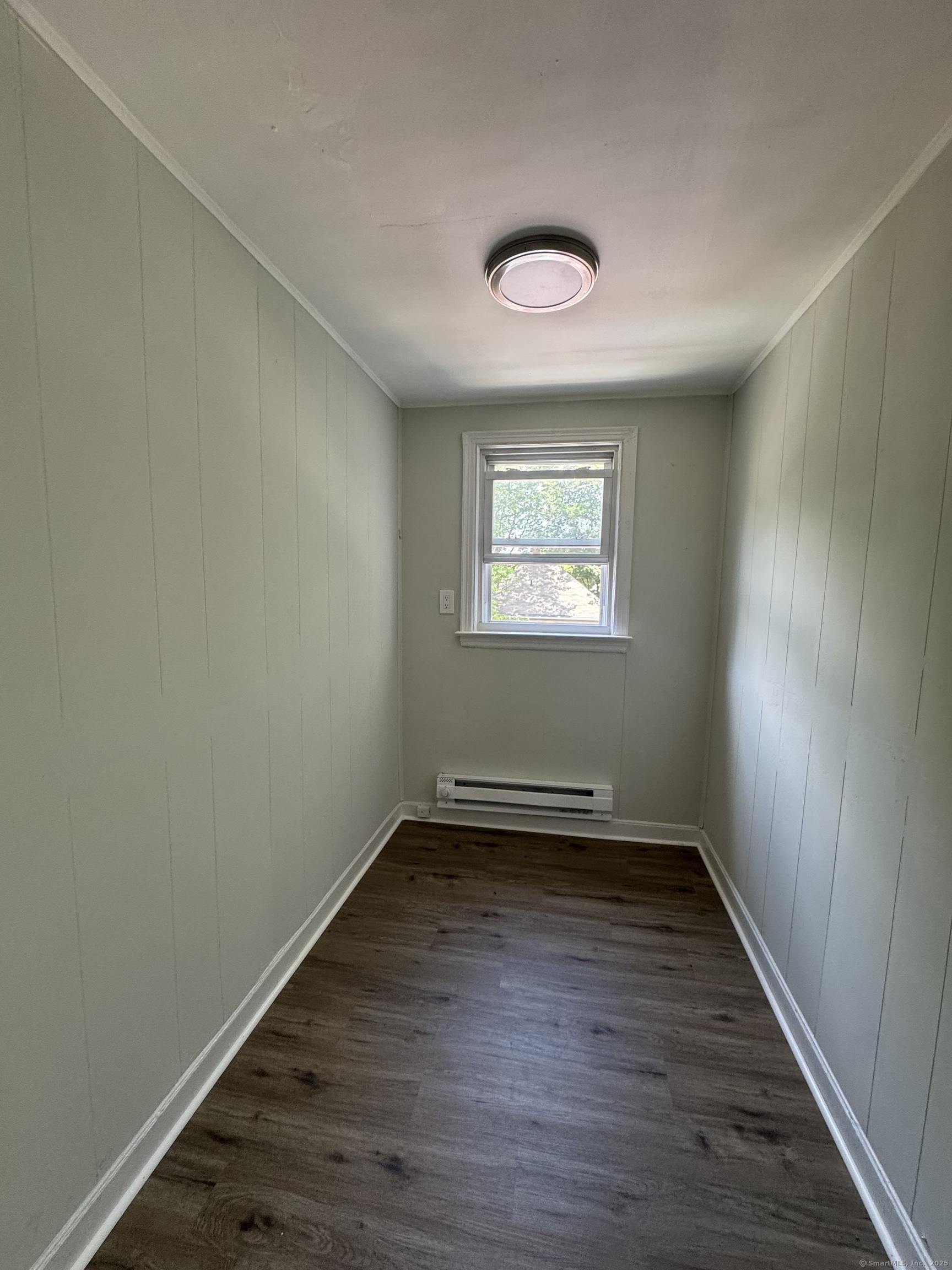 35 Goodyear Street, Unit 2 New Haven, CT 06511 - Photo 6 of 10 an empty room with wooden floor and windows