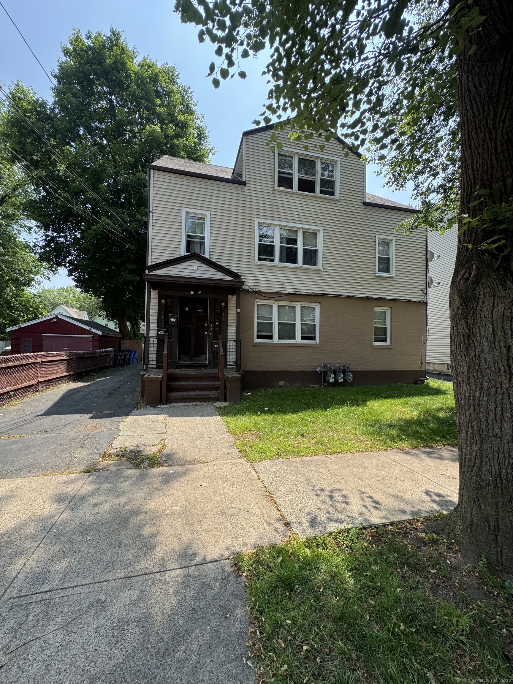 35 Goodyear Street, Unit 2 New Haven, CT 06511 - Photo 10 of 10 a front view of a house with a yard