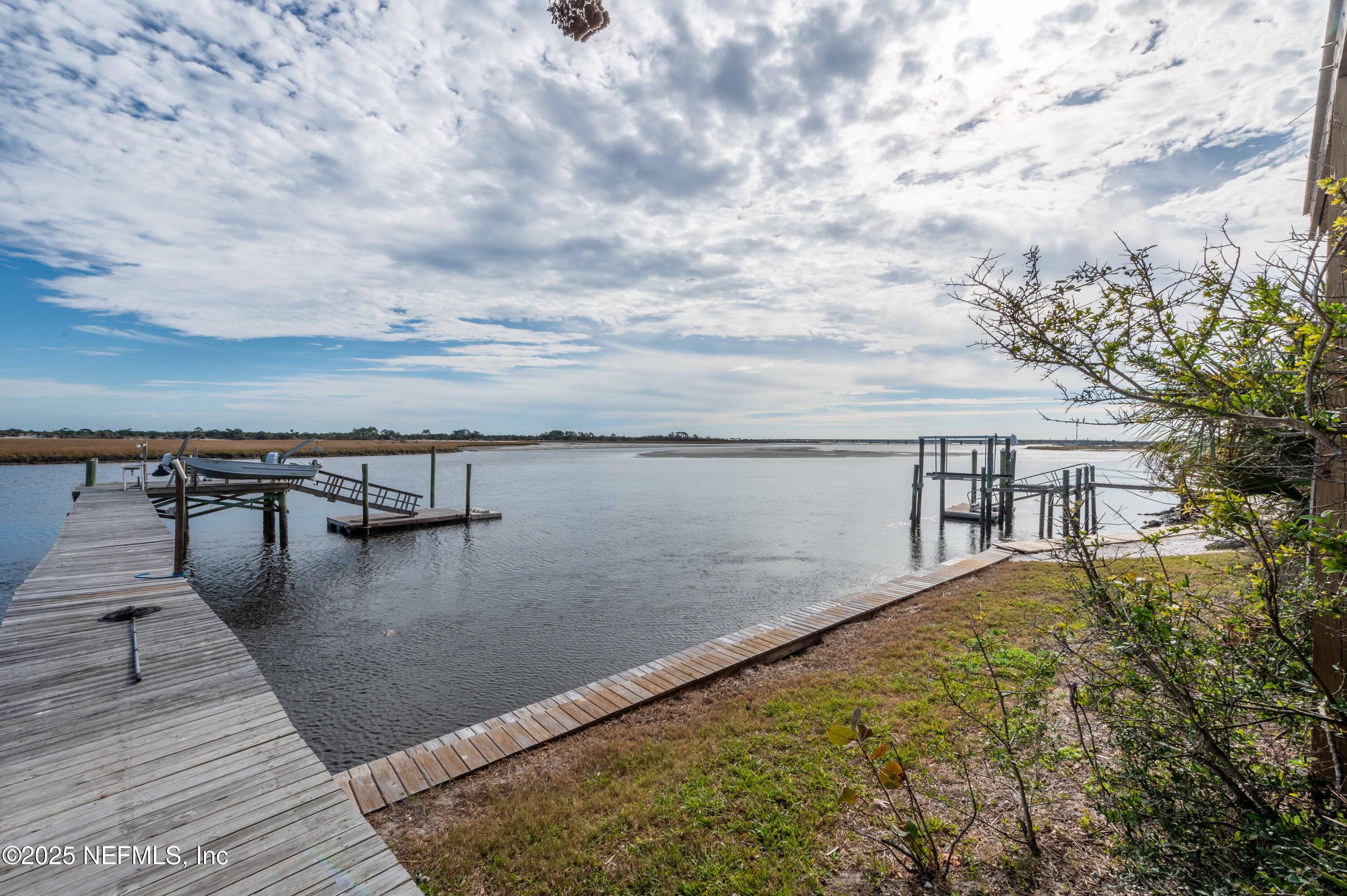 swimming pool view with a lake view