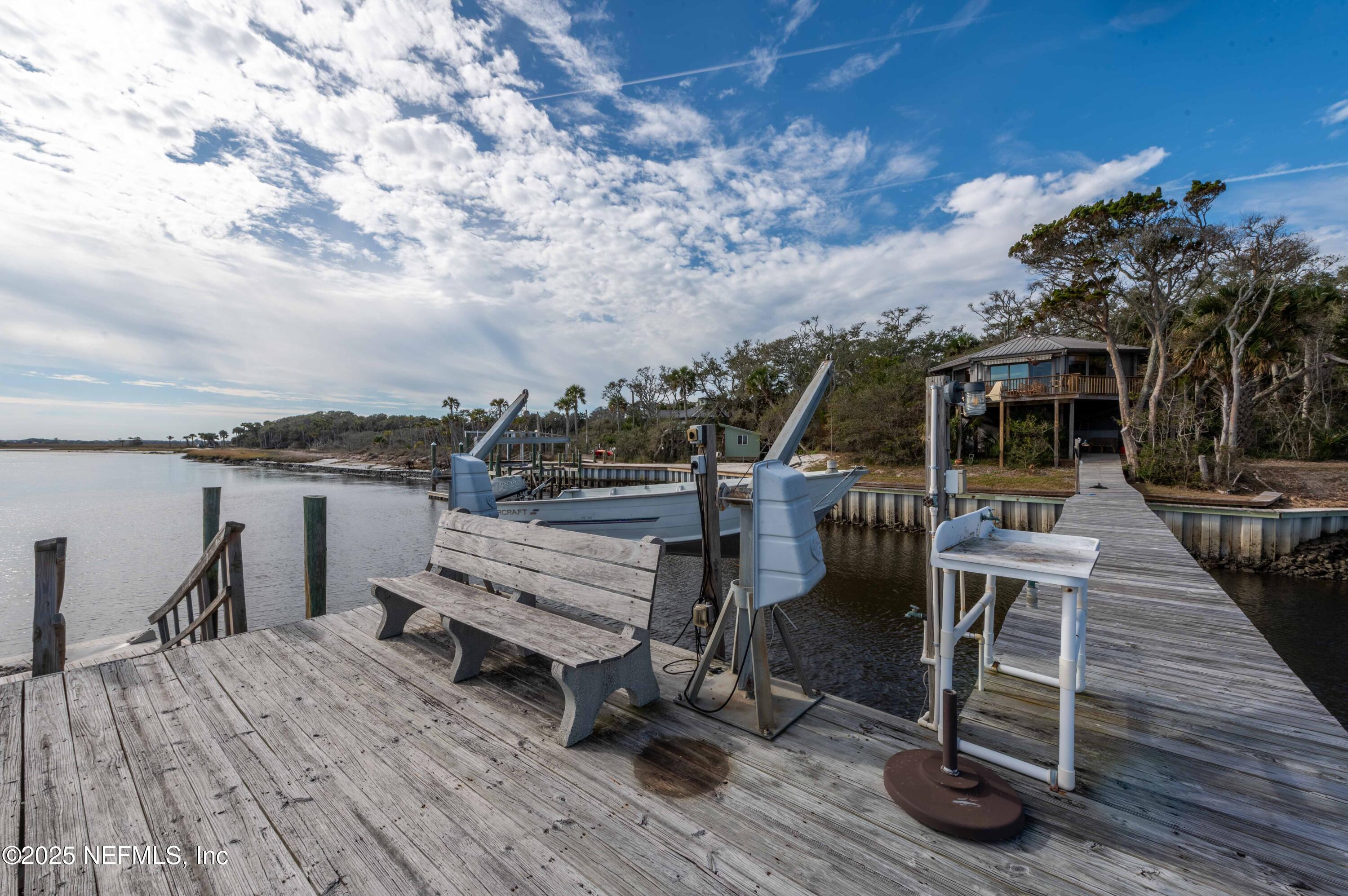 11255 Fort George Road Jacksonville, FL 32226 - Photo 11 of 38 a view of a chairs and table on the wooden deck