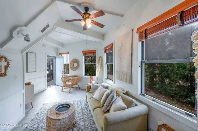 a living room with furniture and a window