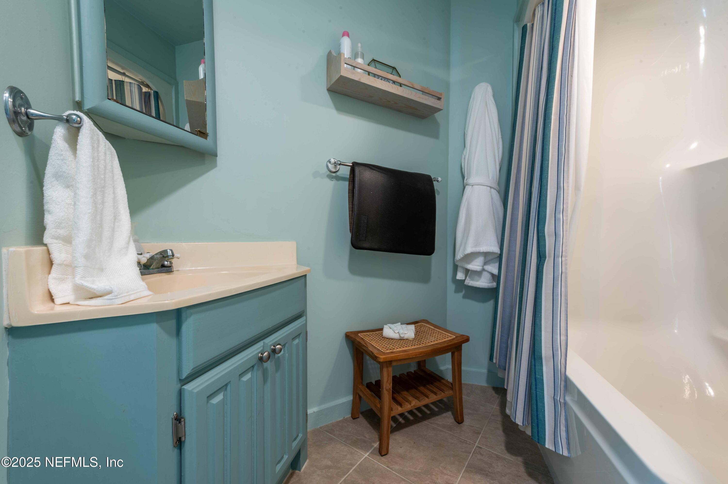 11255 Fort George Road Jacksonville, FL 32226 - Photo 18 of 38 a bathroom with a sink a toilet and a mirror
