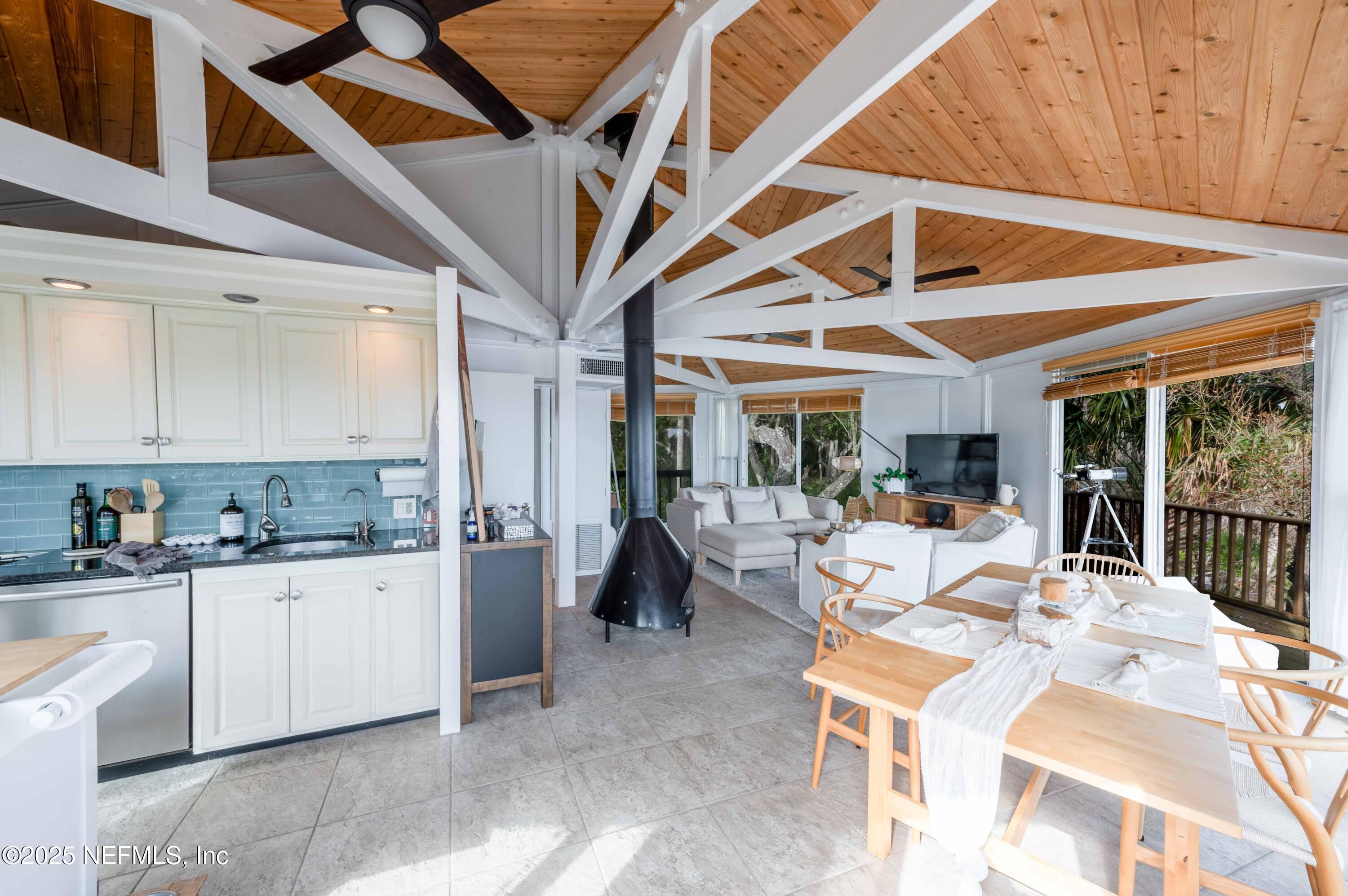 11255 Fort George Road Jacksonville, FL 32226 - Photo 23 of 38 a dining hall with stainless steel appliances granite countertop a sink and cabinets