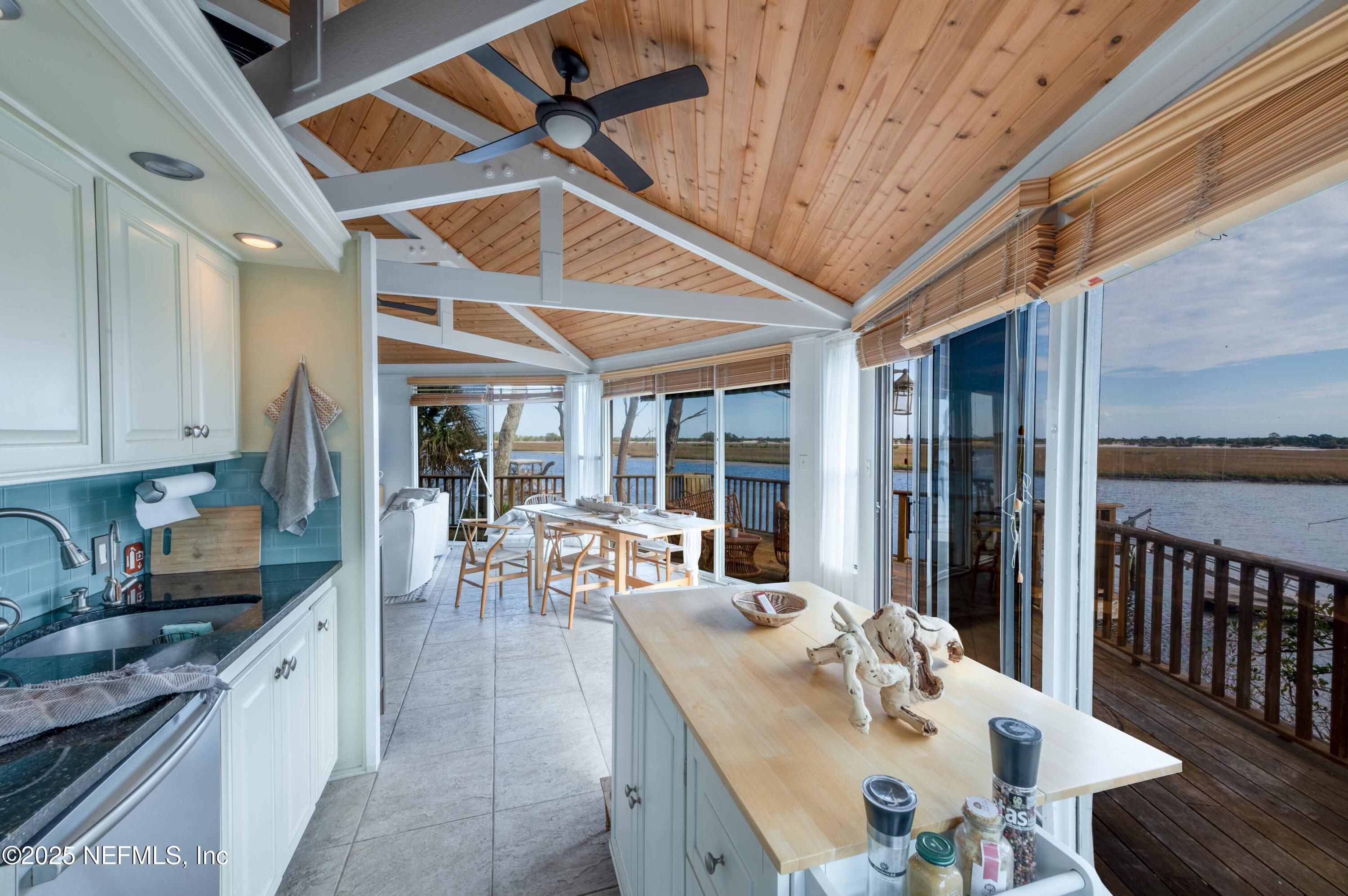 11255 Fort George Road Jacksonville, FL 32226 - Photo 26 of 38 a view of a dining room with furniture window and outside view