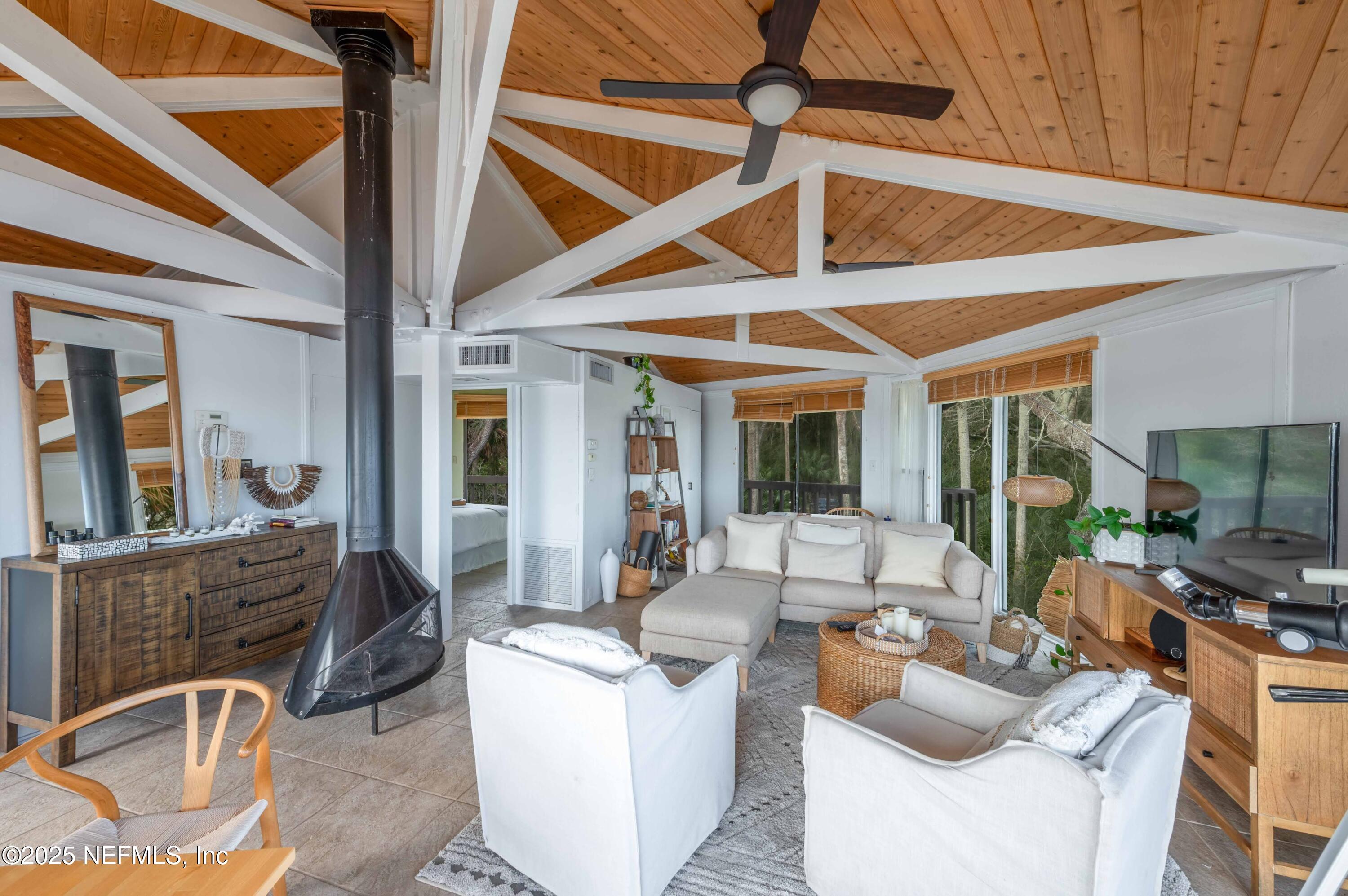11255 Fort George Road Jacksonville, FL 32226 - Photo 29 of 38 a view of a livingroom with furniture and floor to ceiling window