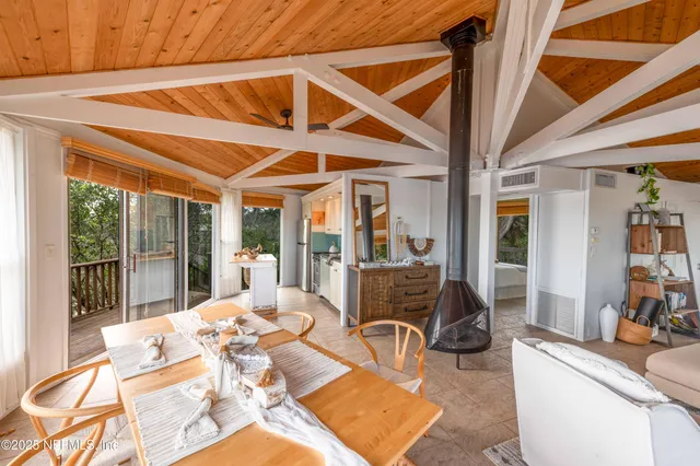 a outdoor space with lots of tables a garden view and chairs