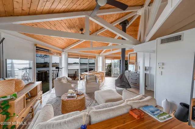 a bathroom with a granite countertop sink mirror and a bathtub