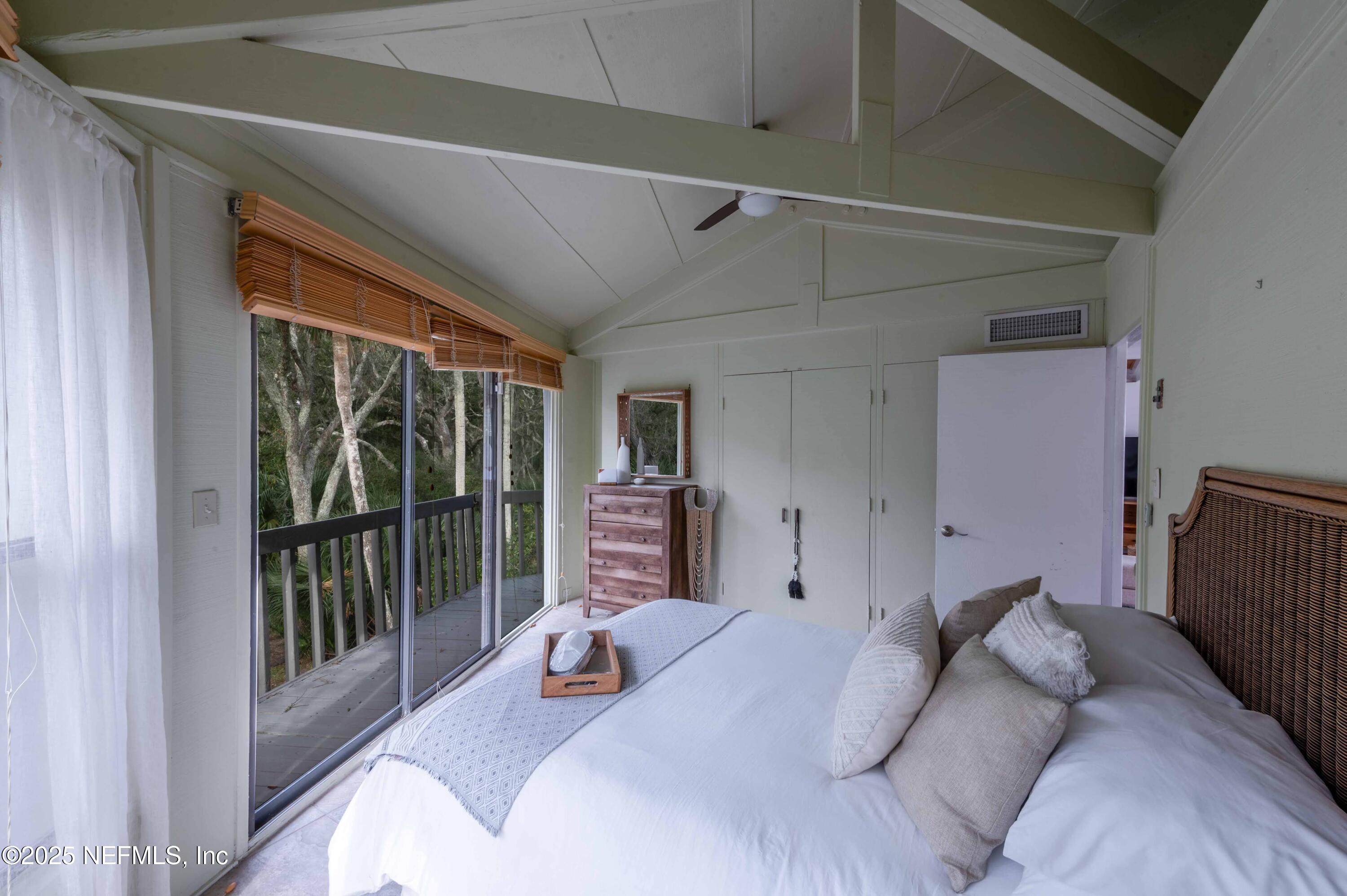 11255 Fort George Road Jacksonville, FL 32226 - Photo 36 of 38 a bedroom with a bed and a large window