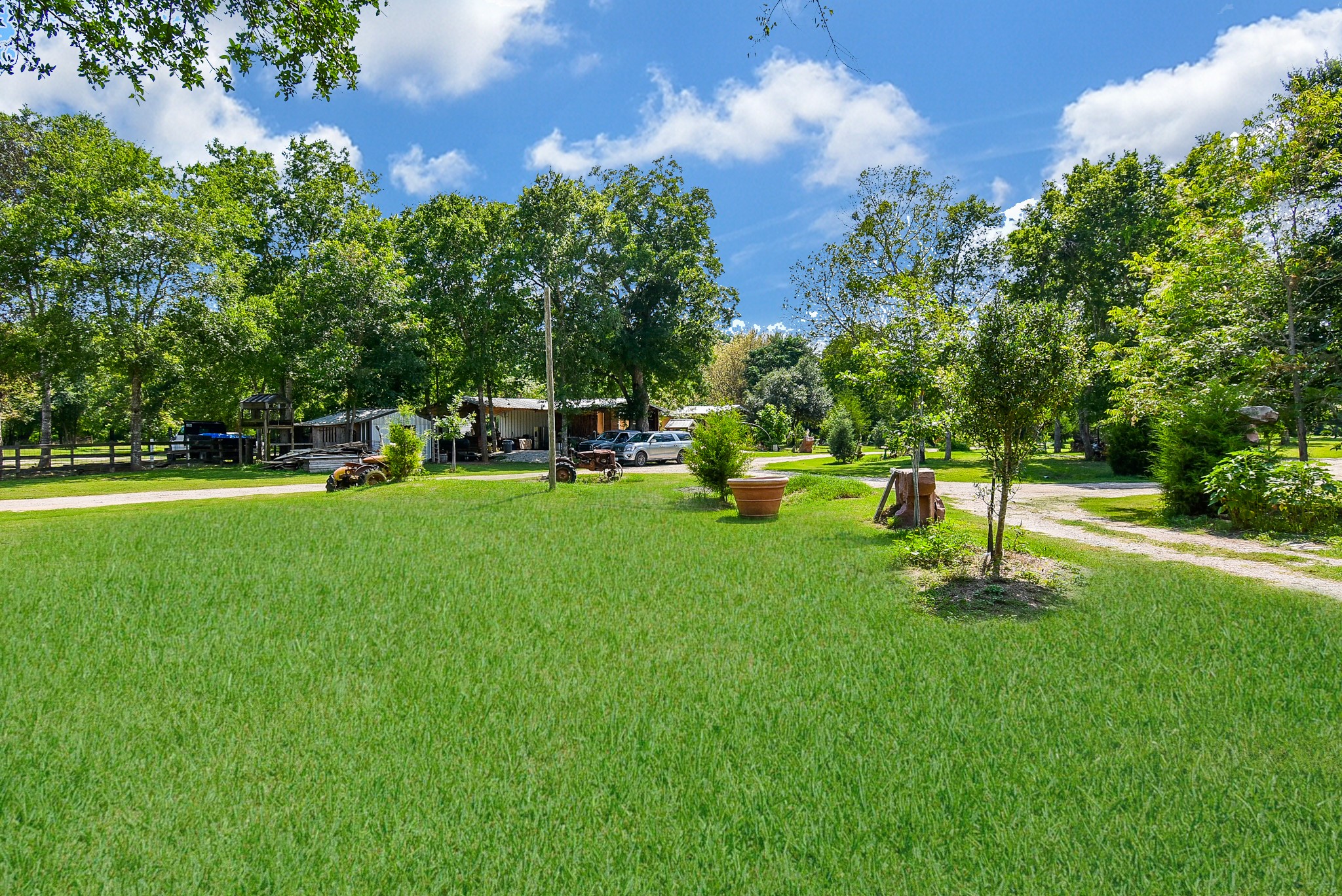 39551 Donigan Road Brookshire, TX 77423 - Photo 12 of 37 a garden with trees in front of it