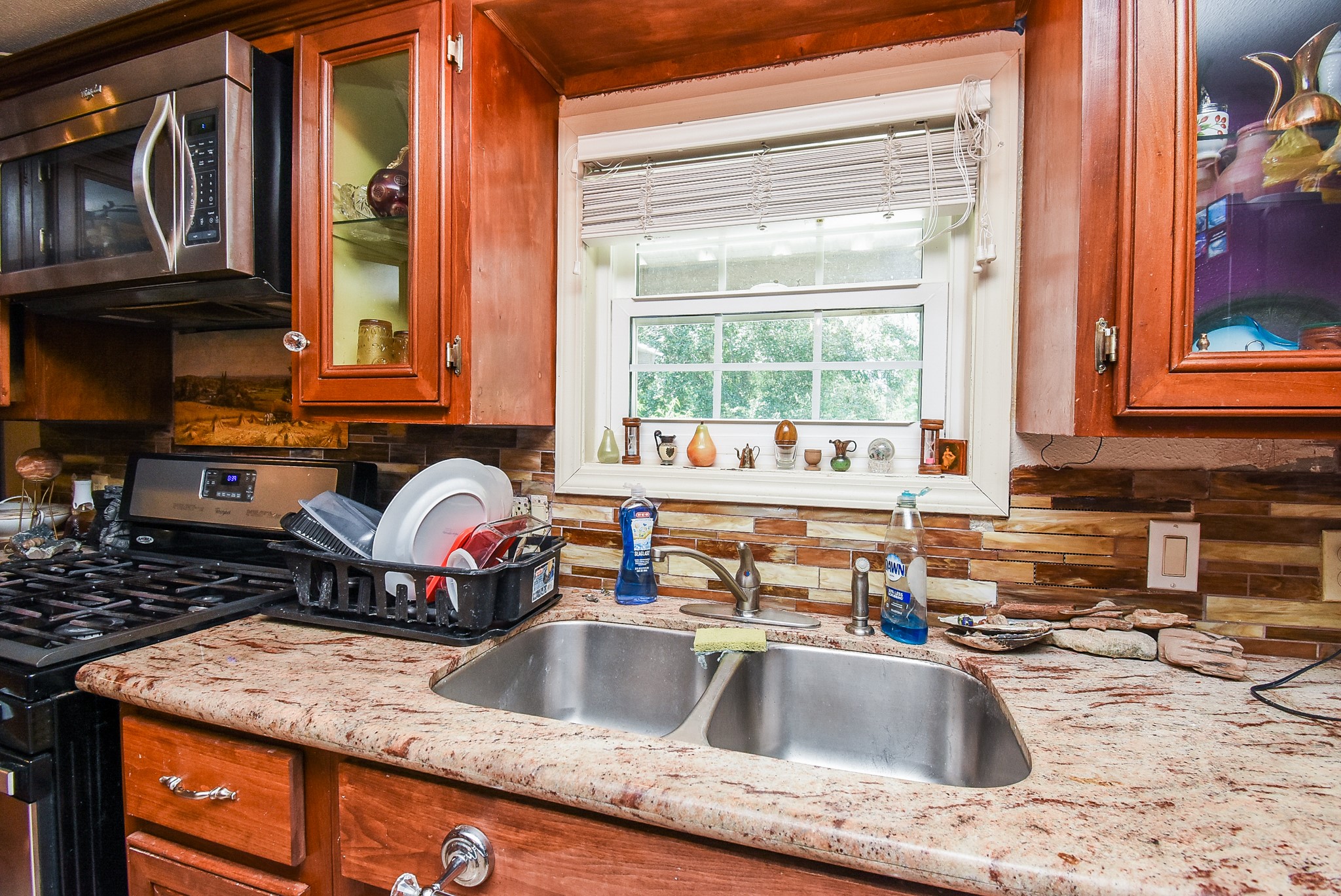 39551 Donigan Road Brookshire, TX 77423 - Photo 21 of 37 a kitchen with a sink a counter and cabinets