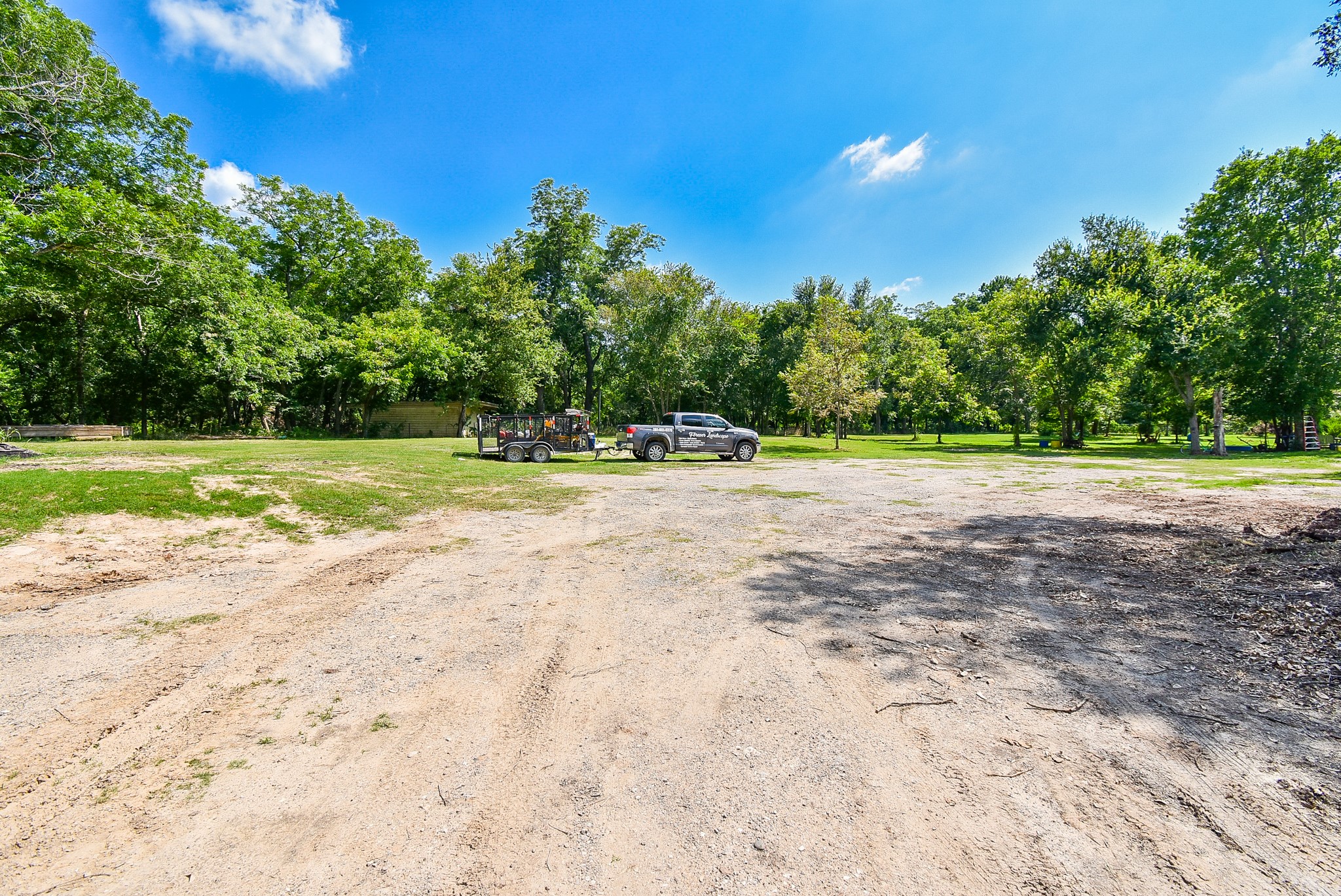 39551 Donigan Road Brookshire, TX 77423 - Photo 31 of 37 a view of a backyard with large trees