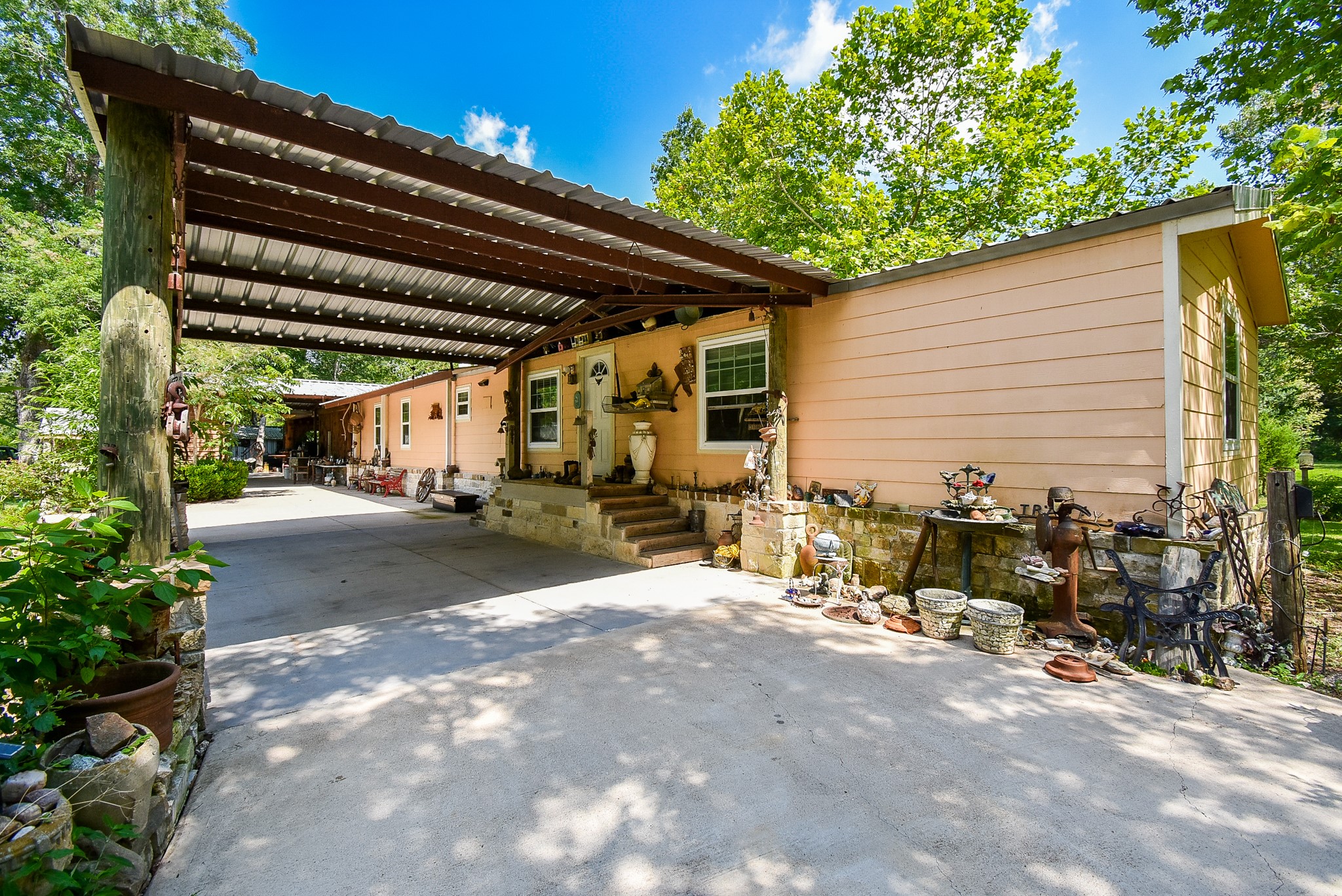 39551 Donigan Road Brookshire, TX 77423 - Photo 7 of 37 a view of backyard with outdoor seating and plants