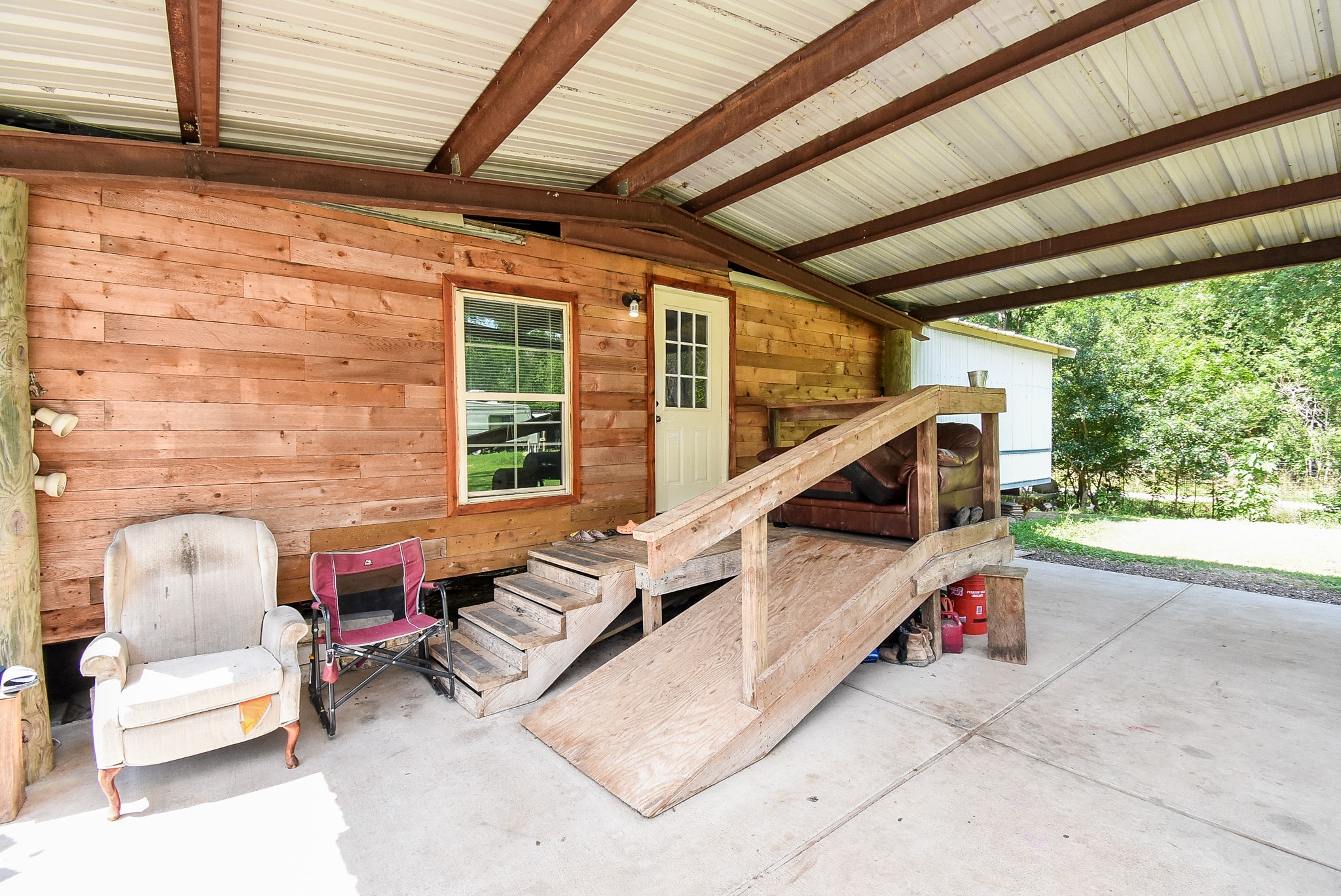 39551 Donigan Road Brookshire, TX 77423 - Photo 9 of 37 a roof deck with chair and table