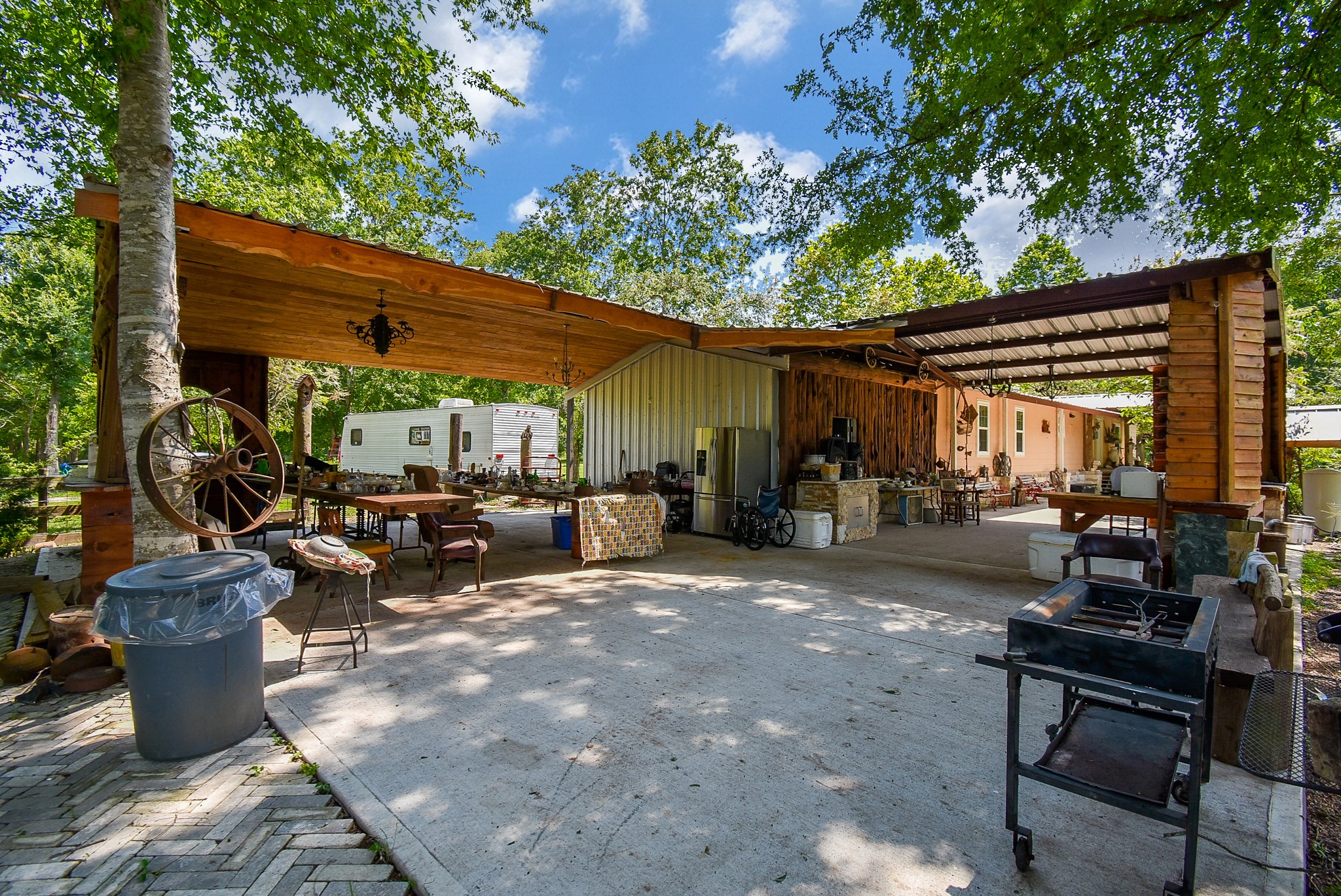 39551 Donigan Road Brookshire, TX 77423 - Photo 10 of 37 a view of a patio with table and chairs under an umbrella