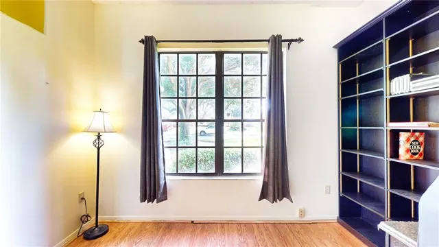 a bed room with a bed and a lamp