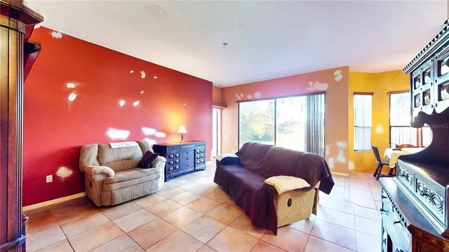 a dining room with a table and chairs