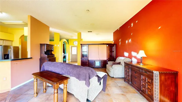a kitchen with stainless steel appliances cabinets and wooden floor