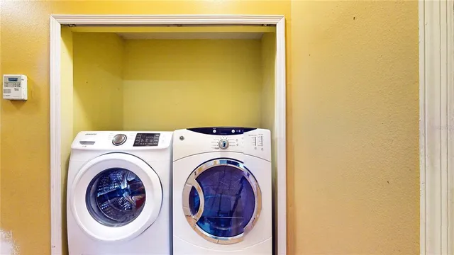 a view of a hallway with painted walls and a large window