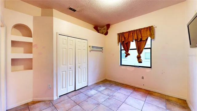a view of a living room with bathroom