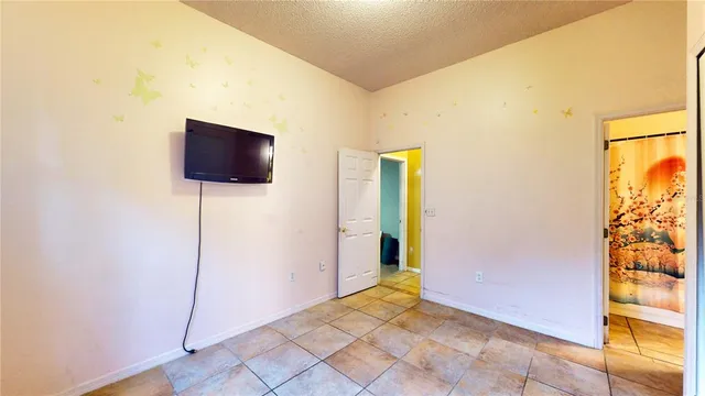 a bed room with a bed and a window