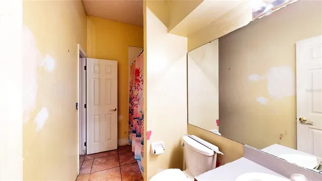 a bathroom with a bathtub and a window