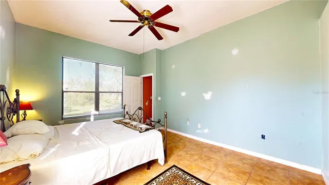 an aerial view of a house with garden space and a street view