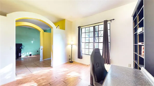 a living room with furniture and a large window