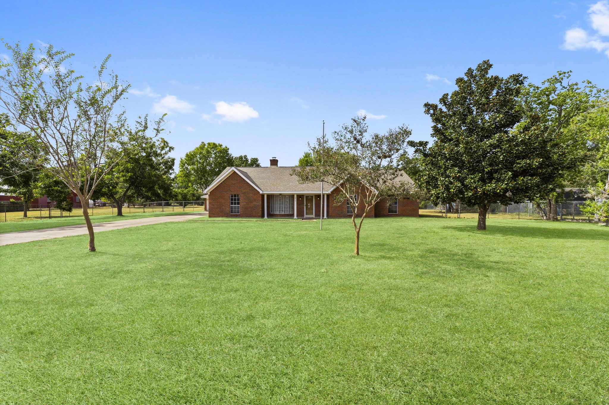 a view of a house with a backyard