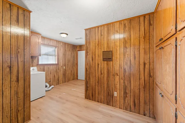 a view of a elevator with wooden floor