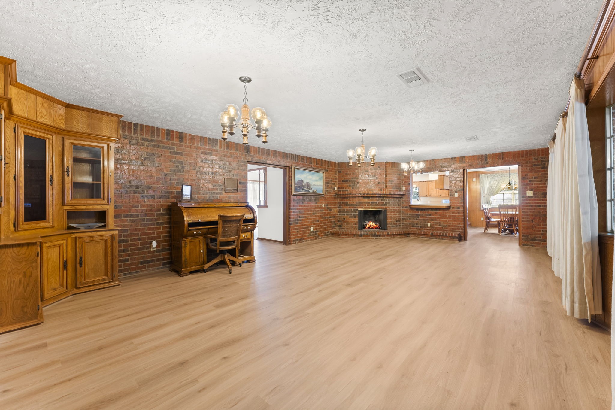 2810 Lilac Street Pasadena, TX 77503 - Photo 20 of 38 a living room with furniture and a chandelier