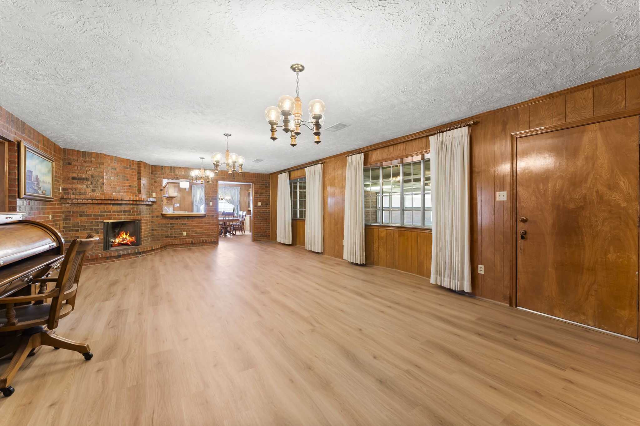 2810 Lilac Street Pasadena, TX 77503 - Photo 21 of 38 a view of a livingroom with furniture flat screen tv and wooden floor