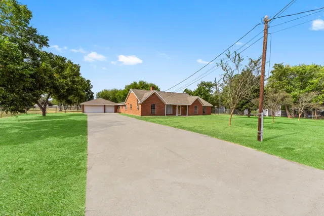 a view of a house with a big yard