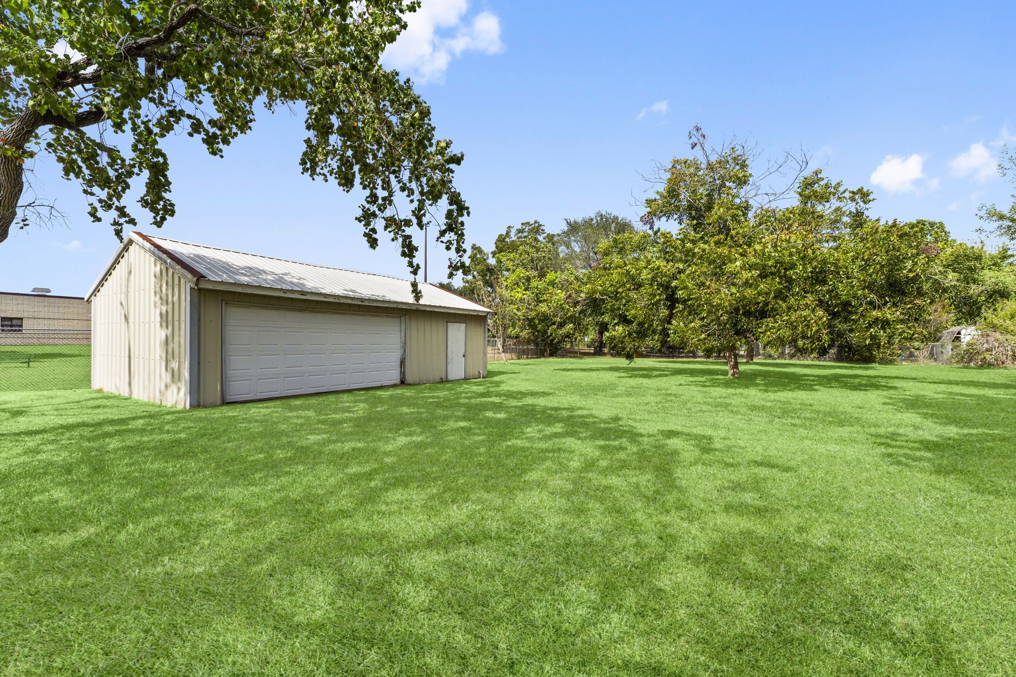 2810 Lilac Street Pasadena, TX 77503 - Photo 33 of 38 a view of a backyard with large trees