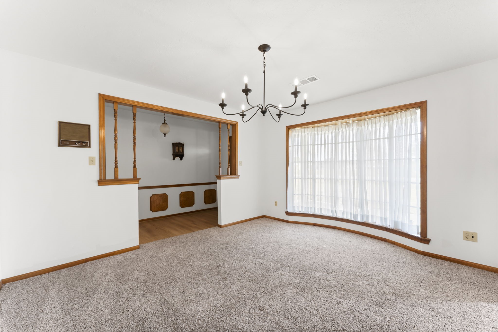 2810 Lilac Street Pasadena, TX 77503 - Photo 7 of 38 an empty room with chandelier fan and windows