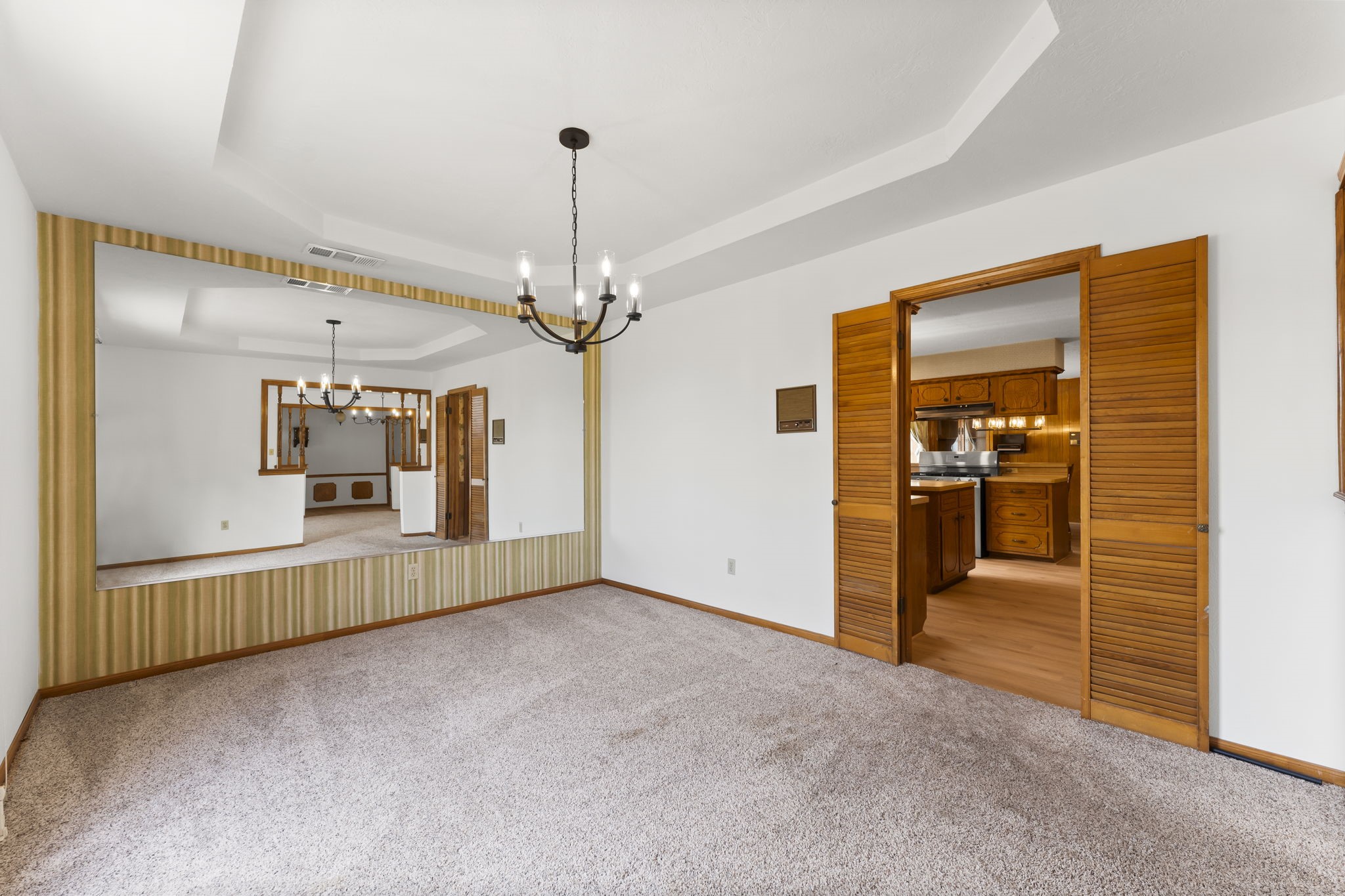 2810 Lilac Street Pasadena, TX 77503 - Photo 9 of 38 an empty room with chandelier fan and windows